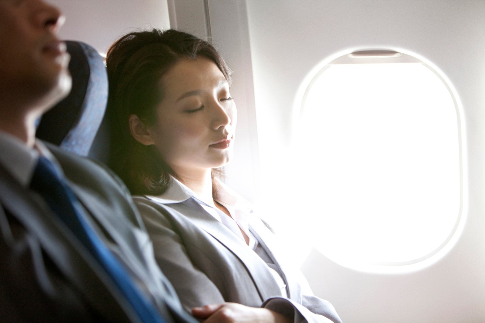 Businesspeople resting on the flight